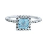 0.85ct Blue Topaz and 0.31ct Diamond Ring in 14K White Gold: 0.25in-wide 0.79 in diameter