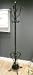 Black ornate coat and hat stand Image