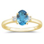 0.10 Cts Diamond & 5.35 Cts Swiss Blue Topaz Three Stone Ring in 14K Yellow Gold