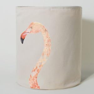 Painted Plumes Flamingo Laundry Hamper Designer: Miji Lee This Painted Plumes Laundry Hamper is inspired by watercolors. Delicately painted exotic birds decorate the surface- majestic flamingos or peacocks lend a graceful edge to this modern home accessory. Stash away your unmentionables and make laundry day a treat- these pretty birds will brighten your day. Description: Graphic Flamingo Laundry Hamper Material: Cotton/Polyester Canvas with PVC Size: 13.75" x 17.75"