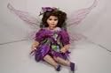 Porcelain Sitting Fairy Doll in Purple Dress