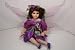 Porcelain Sitting Fairy Doll in Purple Dress