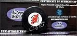 Travis Zajac autographed Hockey Puck (New Jersey Devils)