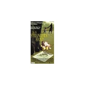 In a Stranger's Hand [VHS]