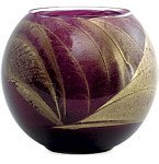 THE INSIDE OF THIS 4 inch POLISHED GLOBE IS PAINTED WITH WAX TO CREATE SWIRLS OF GOLD AND RICH HUES AND COMES IN A SATIN COVERED GIFT BOX. CANDLE IS FILLED WITH A TRANSLUCENT WAX AND SCENTED WITH MYSTERIA. BURNS APPROX. 50 HRS - AMETHYST CANDLE GLOBE