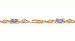 1.50ct total weight oval blue topaz & .05ct total weight diamond 7 bracelet set in 14kt gold.