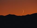 A Crescent Moon Sets over Mountains Rimming the Western Edge of Lake Tahoe Photographic Poster Print by George F. Mobley, 30x40