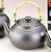Joyce Chen 2 Quart Ceramic Tea Kettle with Bamboo Handle, Ebony