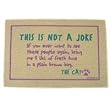No Joke from the Cat Doormat (Taupe background/purple and green letters, 18' x 27')