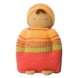 Click here to buy Fair Trade Cuddling Doll - Orange Outift by Peppa.