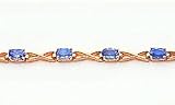3.90ct total weight oval shape blue topaz 7 bracelet set in 14kt gold.