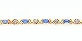 3.30ct total weight oval blue topaz & .12ct total weight diamond 7 bracelet set in 14kt gold.