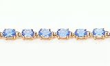12.0ct total weight oval shape blue topaz 7 bracelet set in 14kt gold.