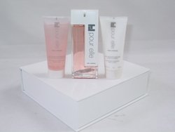 POUR ELLE TED LAPIDUS for Women 3 Piece set: 3.3 oz Eau de Parfum Spray + 3.33 oz Perfumed Bath & Shower Gel + 3.33 oz Velvet-Soft Body Lotion by TED LAPIDUS