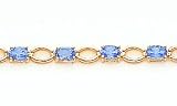 8.40ct total weight oval shape blue topaz 7 bracelet set in 14kt gold.