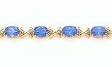 12.0ct total weight oval shape blue topaz 7 bracelet set in 14kt gold.