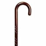 Carved wood Cane - walnut stain color. This traditional walking cane can be used in either right or left hand. This cane is also known as hospital cane. It is made in solid wood, weight capacity 250 pounds, height 36-37 inches. See All King Of Canes Products.