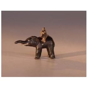 Bonsai Boy's Boy Atop Elephant Reading Book