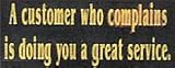 A Customer Who Complains Is Doing You A Great Service Wooden Sign