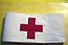 RED CROSS, ARM BAND, 1, GENEVA, CONVENTION, BRASSARD, VAMBRACE, is, ORIGINAL, U.S. GOVERNMENT, ISSUE, VELCRO CLOSUES, SCARLET COLORED, CROSS, WHITE COTTON LEGEND, BACKGROUND, MEDIAL CORPS EMBLEM on INSIDE, Neutrality Brassard, ARMBAND, Size is 4" x 20", is worn in the field, by certain, non-combatant personnel of the, Medical Department, Corps of Chaplains, SPECIAL GROUPS, worn on the left arm, usually half-way between the shoulder and elbow, BOTTLE,