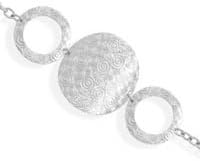 7.5" Triple Circle Design Toggle Bracelet. 7.5" sterling silver toggle bracelet with two 36mm textured swirl design ring links and 51mm center circle with textured swirl design.