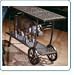 Three Coins Seville Serving Table w/ Wheels - Athenian White