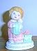 1990 Avon God Bless My Dolly Figurine