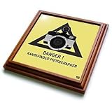 Kike Calvo Photography Collection - Danger.Rangefinder photographer.Black text and triangle, beige background, flash camera - Trivets