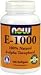   - Vitamin E-1000 100 Softgel 1000 IU ( Vitamin E, or alpha-tocopherol, is a leading antioxidant. Vitamin E helps ease respiratory problems, some of the damage that diabetes does to the body, particularly to the eyes. It also boosts your immune systems ability to fight off infectious diseases by increasing levels of interferon and interleukin. ) By NOW Foods