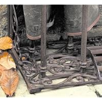 metal (wrought iron) wellington boot stand, showing base of boot stand