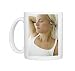 Woman listening to music Photo Mugs