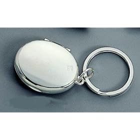 Our oval locket key chain to keep 2 favorite photos close at hand