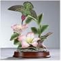 Hummingbird Over Flowers
