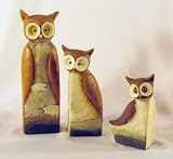 An Owl family made in resin in a set of 3 in descending size with the tallest standing 190mm (7.5) tall.