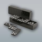 DOMINOES/DOMINO [Made in Russia. Classic dominoes, in black plastic] [A version of the traditional game of dominoes. Large chips and simple rules allow even the very youngest players to quickly take part in it with pleasure. The game develops attention span, attentiveness, memory, and the ability to make decisions independently. To Play: Turn all dominoes face down and mix them up. Each player chooses five dominoes and stands them on the edge, facing so that the other players cannot see the dots. The remaining dominoes become the draw pile. The player who has chosen the highest double domino goes first. He places it in the center of the table to begin. The second player tries to match one of his dominoes to one end of the double. Game continues until one player has used up all of his dominoes or until no one can make a move]