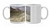 Sea and salt formations with hotels and desert cliffs beyond Photo Mugs
