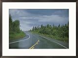 The Alaskan highway glistens from rainfall near Anchorage, Alaska Scenic Framed Art Poster Print by Stacy Gold, 29x21