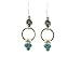 3 opal stones hanging on a silver ring with a swirl motif
