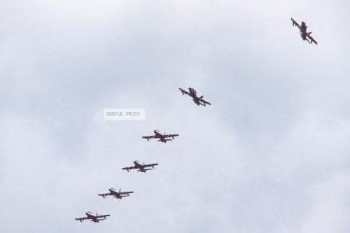 Photo A ground-to-air view of six Aermacchi M.B. 339PAN aircraft, from the Italian Air Force Frecce Tricolori aerobic team, as they begin to break out of echelon formation during a demonstration, 05/05/1983