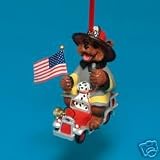 RESIN FIREFIGHTER BEAR HOLDING FLAG ON TRUCK ORNAMENT