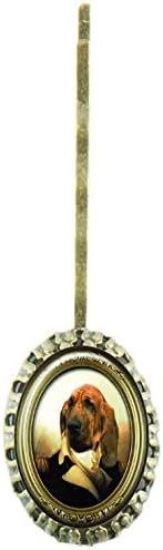 Scalloped hairpin with oval glass cabochon protecting a design with a dog dressed up an army general