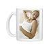 Woman listening to music Photo Mugs