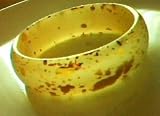 Yellow bangle bracelet with gold flecks