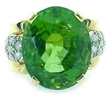 An Estate 22.79 ct Fine Peridot Ring with 0.50 ct of Diamonds