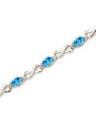 10K White Gold Oval Blue Topaz and Diamond Bracelet