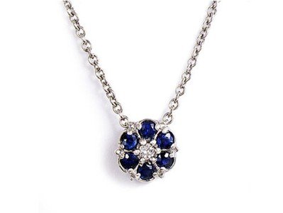 14K White Gold 9MM Flower Pendant Enhanced with Sapphire and Prong Set Diamonds on a 16'' Cable Chain.