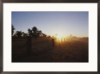 # Sunset through dust cloud on drought-stricken farm
