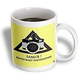 Kike Calvo Photography Collection - Danger.Rangefinder photographer.Black text and triangle, beige background, flash camera - Mugs