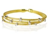 18 Karat Yellow Gold Three-Strand Wire Bracelet, Enhanced with Bezel Set Diamonds.