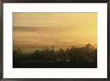 A foggy twilight view over the Hukawng Valley Places Framed Art Poster Print by Steve Winter, 29x21